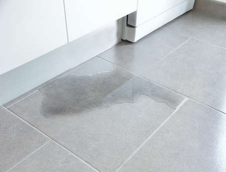 Close-up Photo Of Flooded Floor In Kitchen From Water Leakの写真素材