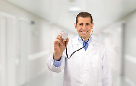 Male medicine doctor hand holding stethoscope head. Physician ready to examine patient, physical and disease prevention concept at hospitalの写真素材