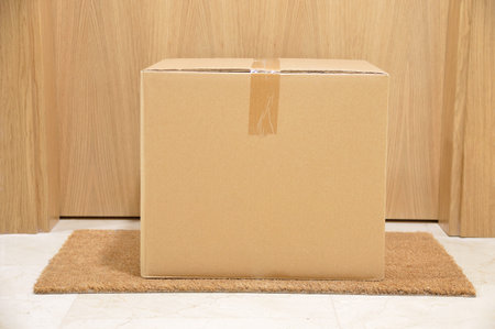 carton box on the floor of doorway home
