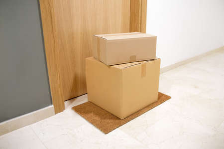 carton box on the floor of doorway homeの写真素材