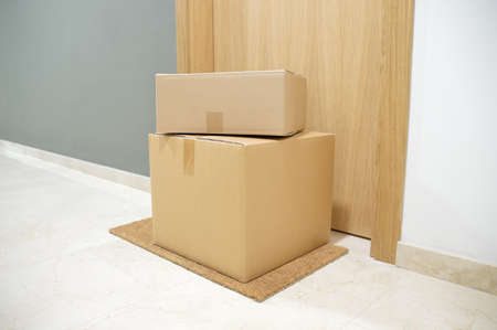 carton box on the floor of doorway homeの写真素材
