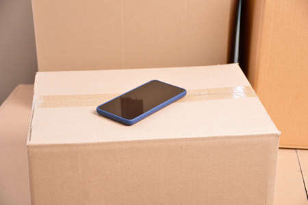 Close Up shot of an a smartphone on a boxの写真素材