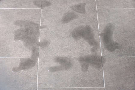 Wet floor square tile at homeの写真素材