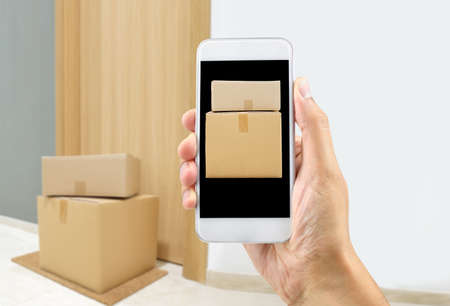 Fast delivery flat and caucasian man with phone online.Fast shipping to the door of your house.の写真素材