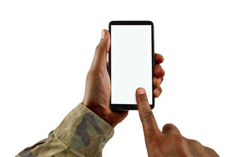Man hand is holding a white modern smart phone with uniform military against a white background and copy space.の写真素材