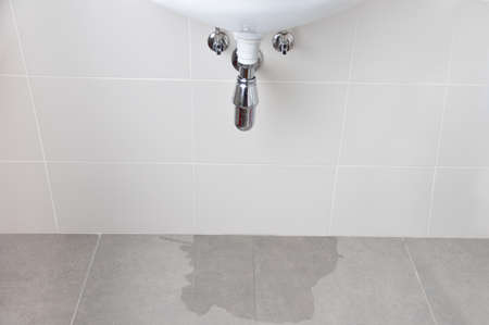 Water damage in home caused by due to clogged sanitary drainの写真素材