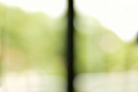 Fuzzy office photo with a window and views of a forestの写真素材