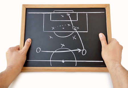 coach with a blackboard with tactics with white backgroundの写真素材