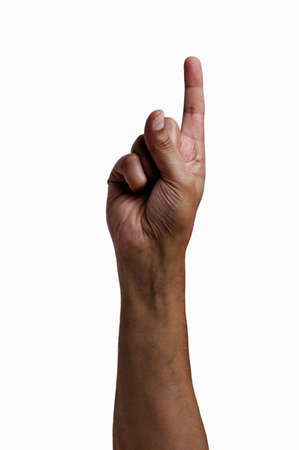 Close-up of man hand showing forefinger up with white backgroundの写真素材