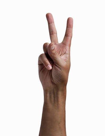 Close-up of man hand showing two fingers with white backgroundの写真素材