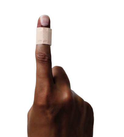 Forefinger of a african man hand with a bandage isolated on whiteの写真素材