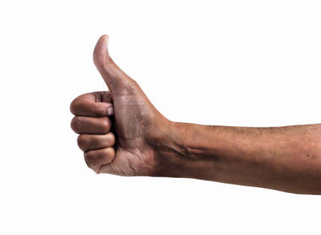 hand of an African man tossing a coin isolated on whiteの写真素材