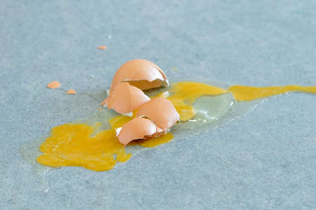 broken egg on the kitchen floorの写真素材