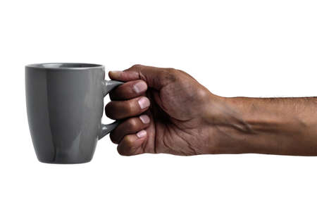 Hand of an African man tossing a coin isolated on whiteの写真素材
