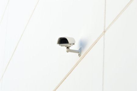security camera working on the wall of a building