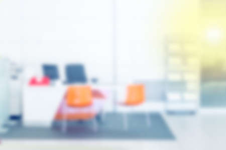 Blur in the workplace or work space of table work in office with computer or shallow depth of focus of abstract backgroundの写真素材