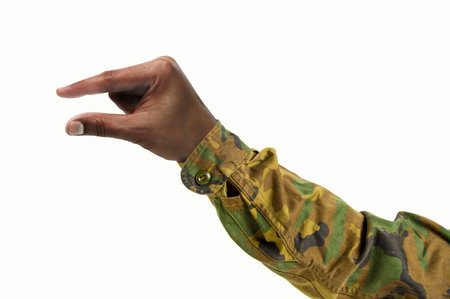 Man hand making the symbol that means pick up on white backgroundの写真素材