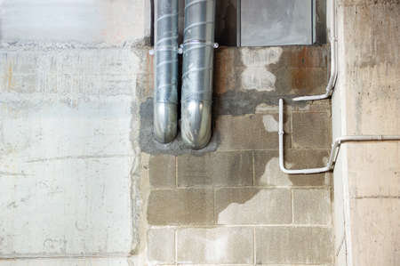 Water leak in a wall due to damaged pipesの写真素材