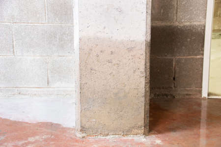 Damage to a concrete column from water in the basementの写真素材