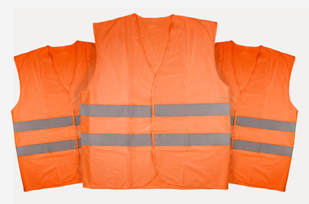 Three orange vests on white background