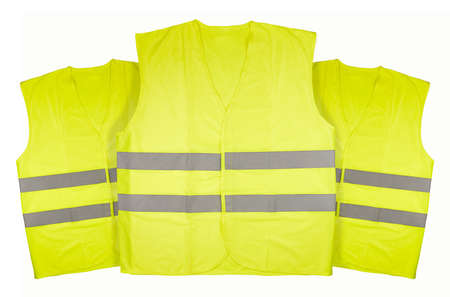 Three yellow vests on white backgroundの写真素材