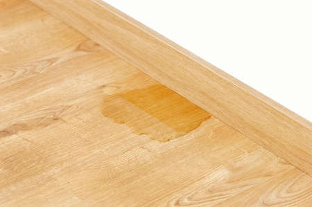 wood laminate parquet with water leakの写真素材