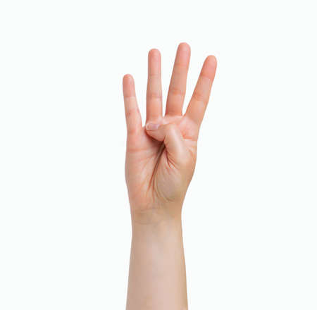 Woman hand showing four fingers isolated on whiteの写真素材