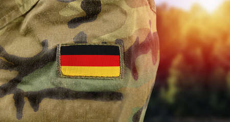 Germany flag on army uniform at outdoorの写真素材
