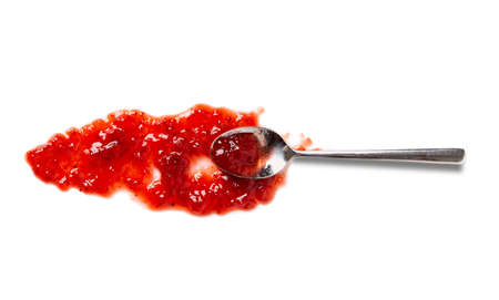 Spoon with sweet jam on white backgroundの写真素材