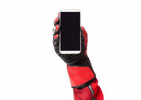 Biker hand holding smartphone with blank screen cropped image and copy spaceの写真素材