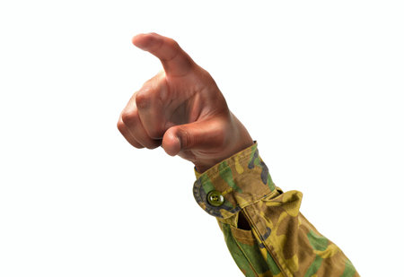 Cropped shot of an unrecognizable soldier hand pointing or pushing with forefinger on a white isolated backgroundの写真素材