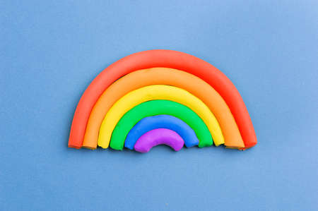 Plasticine rainbow on color blue backgroundの写真素材