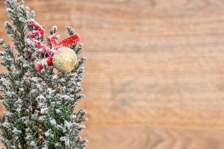 Retro christmas tree with snow and copy space with wooden backgroundの写真素材