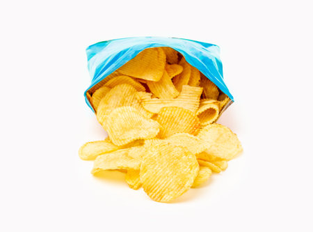 heap of potato crisps on white background