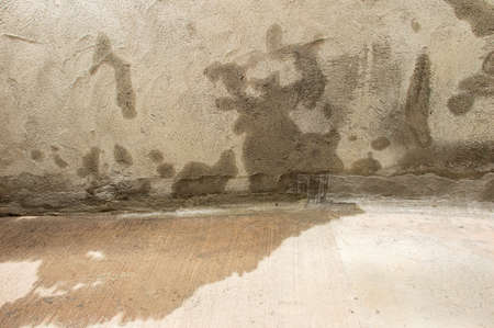 Entrance to a parking lot with entrance of outside water caused by heavy rainsの写真素材