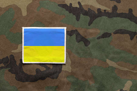 Cropped close up shot of the ukraine flag on a soldier's uniform with copy space.の写真素材