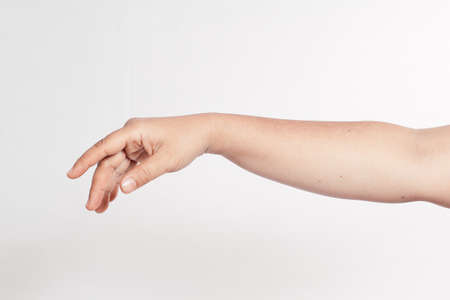 hands dangling down. white background, isolatedの写真素材
