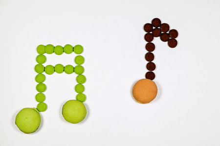 Musical notes made ​​with chocolate candy and macaronの写真素材