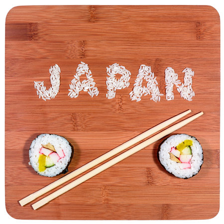 japan rice sushi pieces and written with chopstick on bambooの写真素材