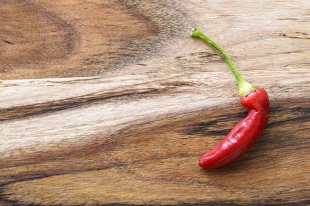 red hot chilli on wooden backgroundの写真素材