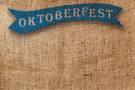 oktoberfest blue ribbon on jute backgroundの写真素材