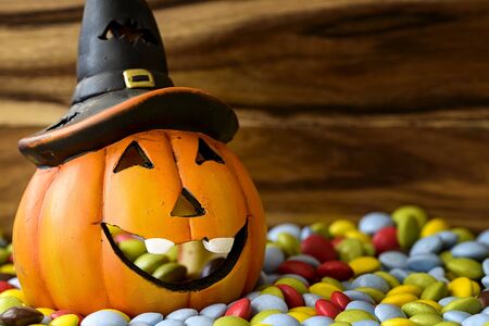 halloween pumpkin with chocolate candyの写真素材