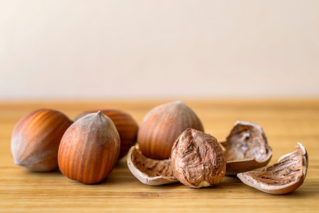 hazelnut and nutshell on wood