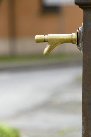tap of a fontain inactive in urban outdoorの写真素材