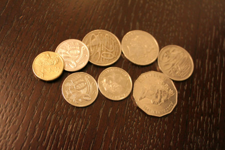 Australia Dollar Coin on the wood  AUDの素材