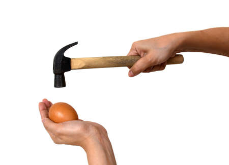 two hand hold egg with hammerの写真素材