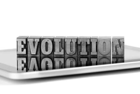 The word EVOLUTION in old plumb letters on a tablet computerの写真素材