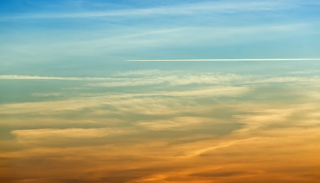 plane leaves traces on the background of clouds