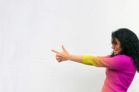 girl playing and pretending to have a gunの写真素材