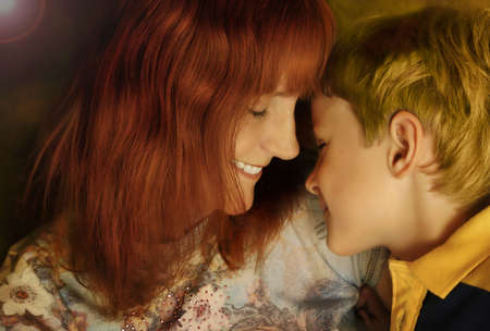 mom and son laughing and facing each otherの写真素材